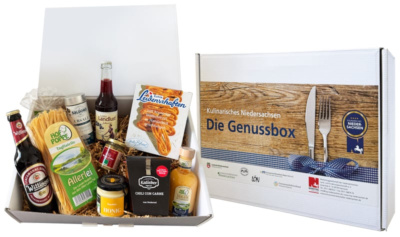 Genussbox Niedersachsen geöffnet mit Produktauswahl neben geschlossener Geschenkverpackung